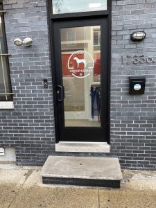 The front door of Groom & Board, the Point Breeze doggy day care