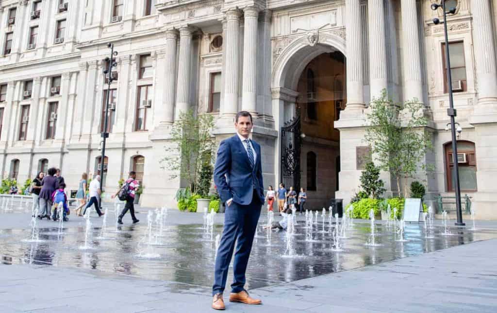 Jordan Strokovsky standing in front of City Hall in Philadelphia, PA